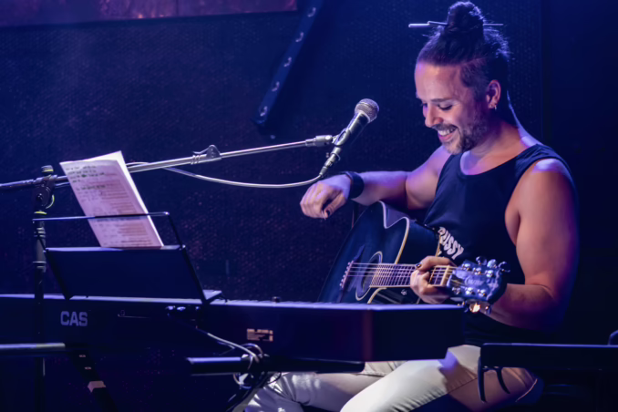 Giacomo Voli Queen Tribute (Live at Le Brin de Zinc, Barberaz, France, June 22, 2025) Giacomo Voli performing Queen acoustic songs. He's sitting behind keyboards and plays an acoustic guitar.