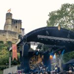 View of the stage of the Kave Fest with the Castle of Gisors in the background.