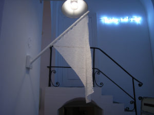 white flag made of glass beads