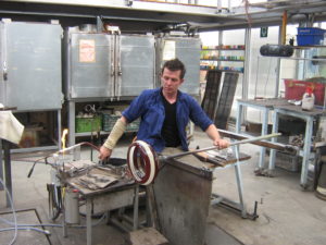 Glass blower Gert Bulle blowing plates