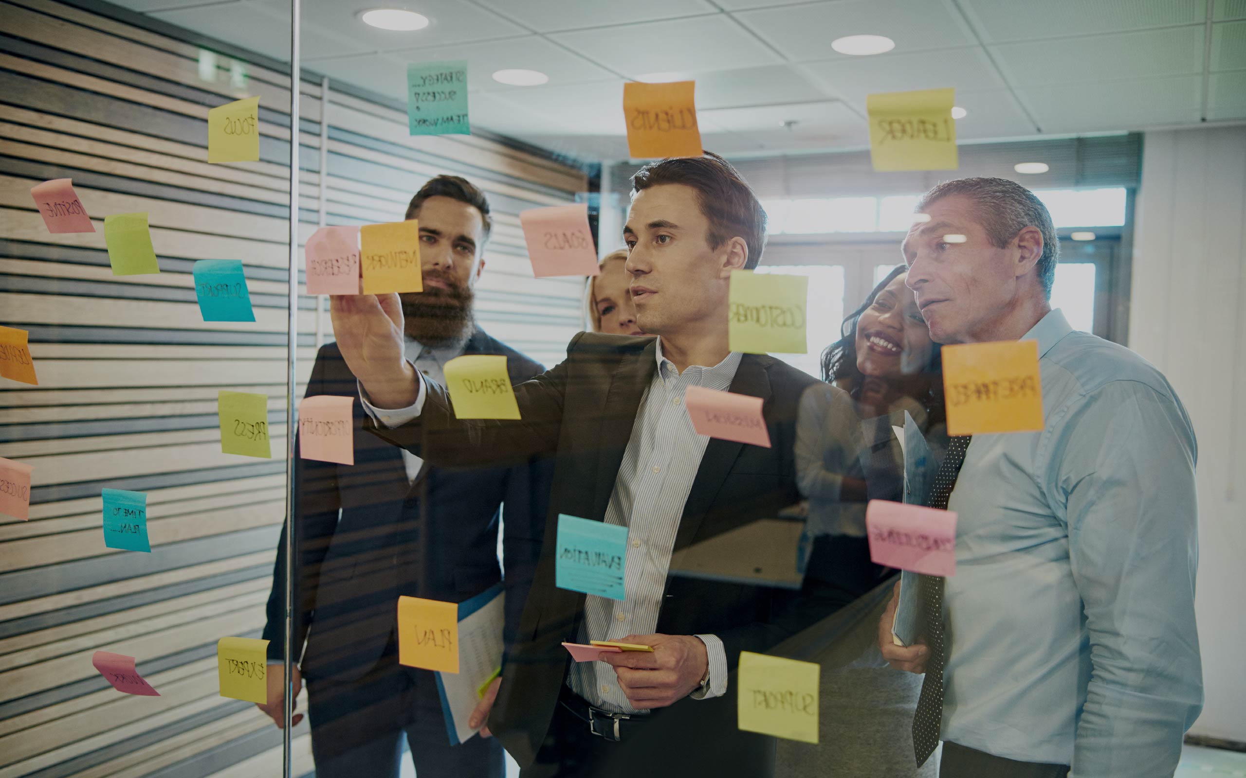 Employees looking at a whiteboard