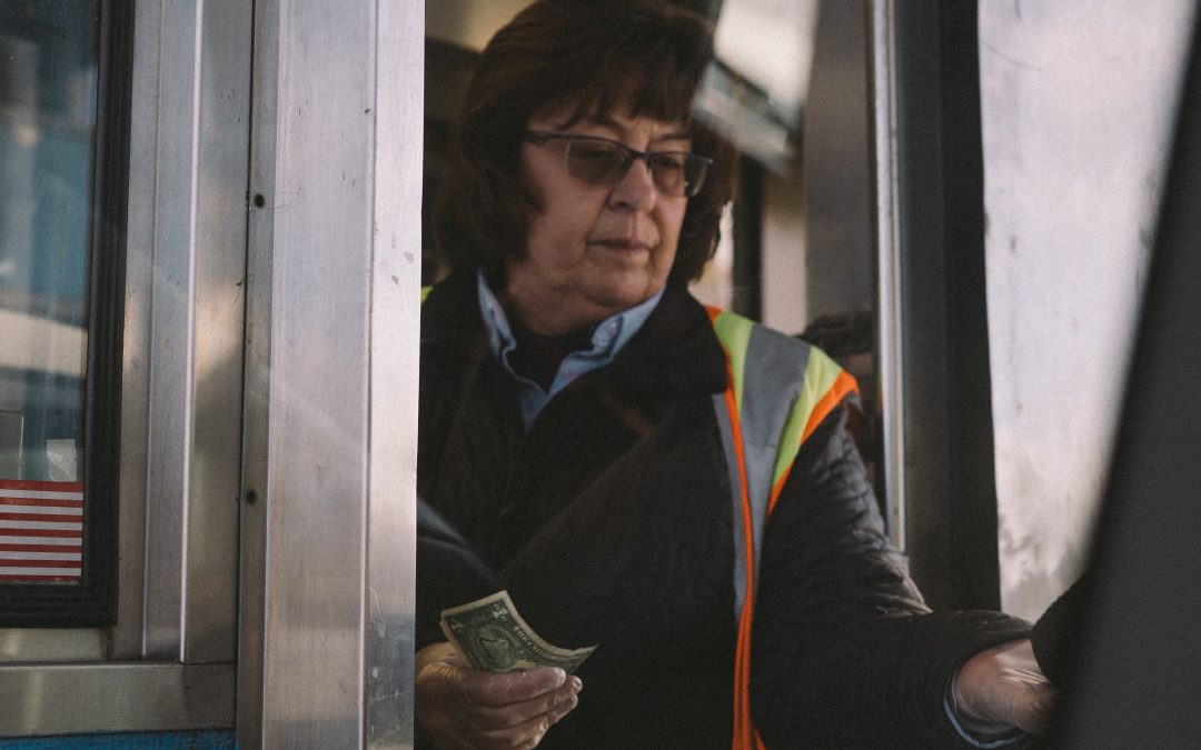 Person taking toll from a highway user