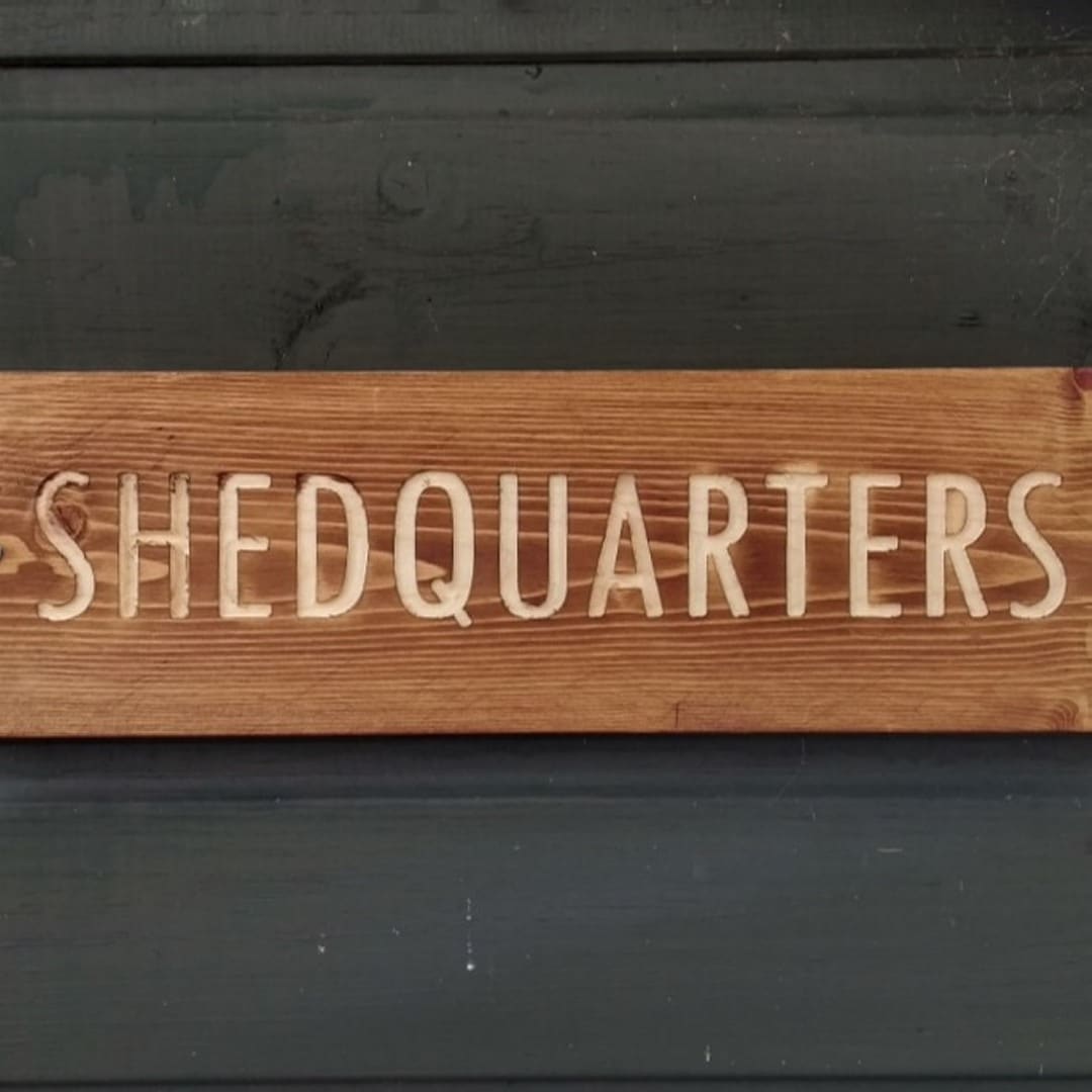 cnc milled shedquarters sign in pine stain finish