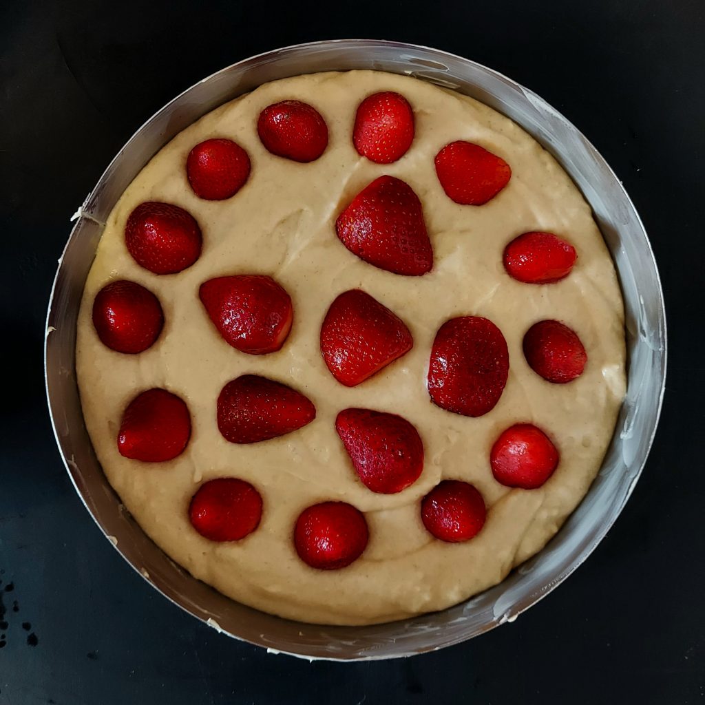 Adding Strawberries for Strawberry Crumble Cake