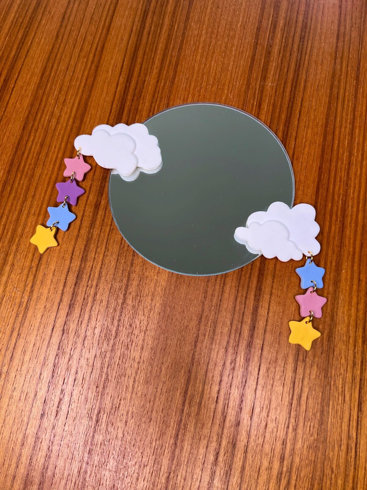 Mirror with handmade polymer clay clouds and star decorations