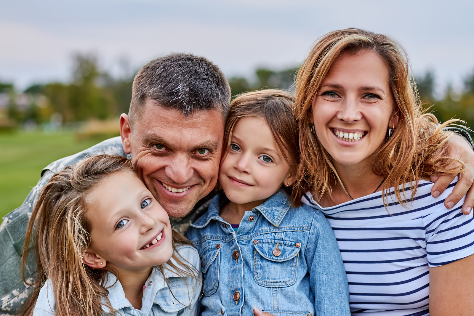 Portrait Of Happy Family. Shot Of Smiling Cheerful Mature Soldie