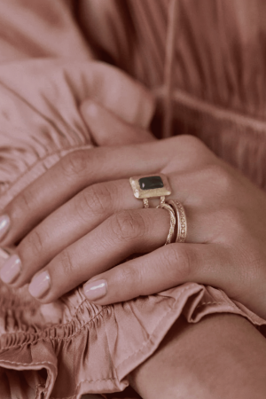 woman wearing the Aristide Ring by the brand Agape Studio