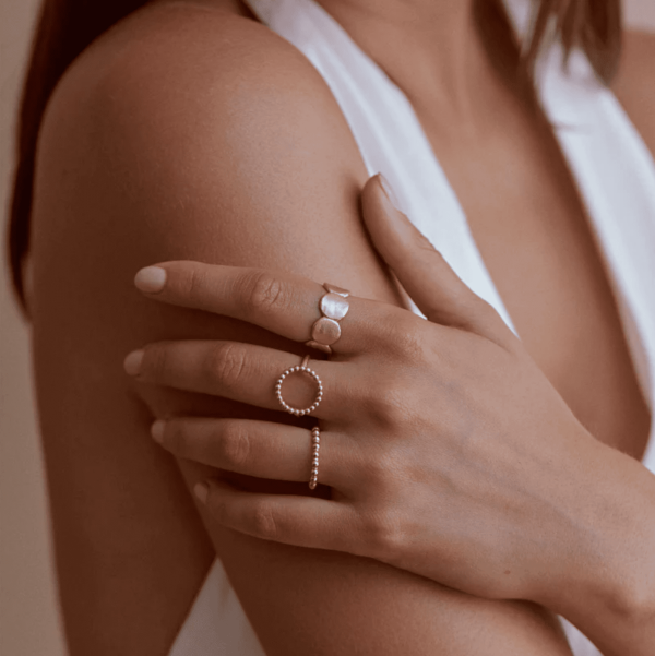 woman wearing the Elna Ring by the brand Agapé Studio