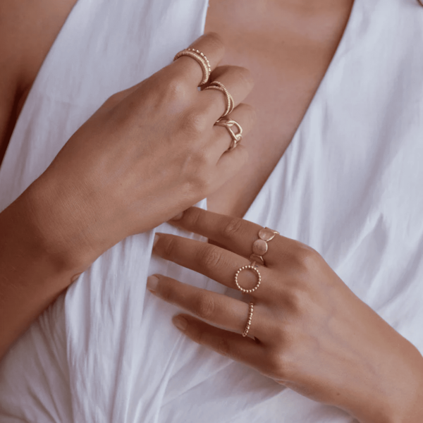 woman wearing the Elna Ring by the brand Agapé Studio
