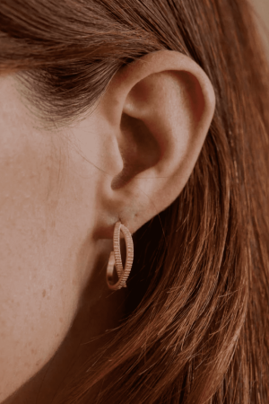 woman wearing the Louise Earrings by the brand Agape Studio