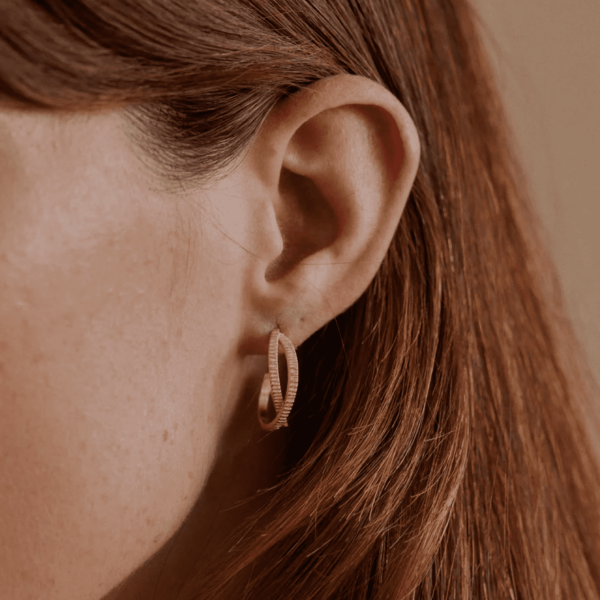 woman wearing the Louise Earrings by the brand Agape Studio