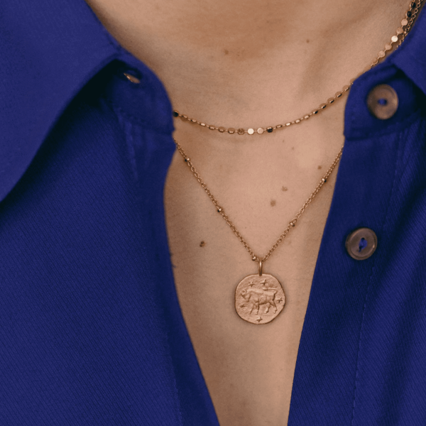 woman wearing the Scorpio Necklace by the brand Agapé Studio