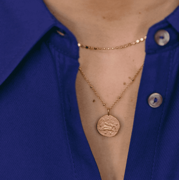 woman wearing the Virgo Necklace by the brand Agapé Studio