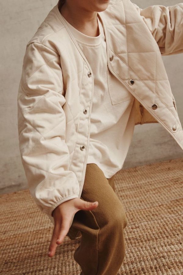 boy wearing the Walter Tee in Cream paired with the Isobel Jacket & the Arthur Worker Pants by the brand Alfred