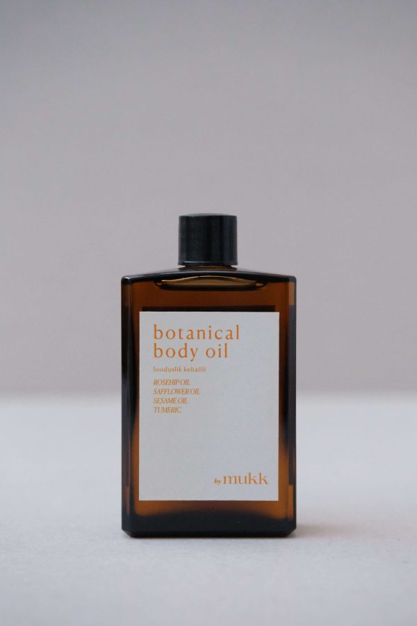 Front view of the Botanical Body Oil by By Mukk showing the aesthetically pleasing product design with the ingredients listed on the front of the product