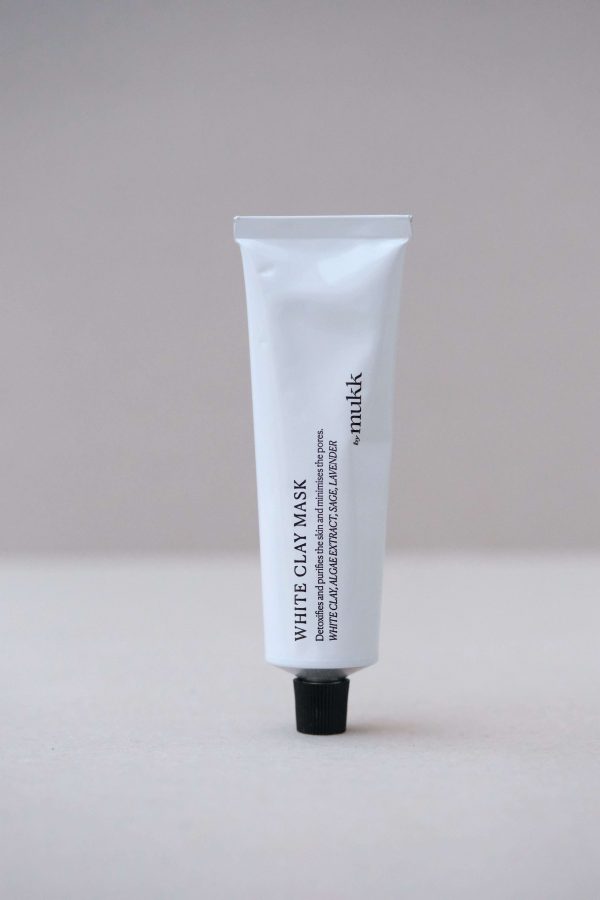 front view of the White Clay Mask by By Mukk showing the aesthetically pleasing product design with the ingredients listed on the front of the product