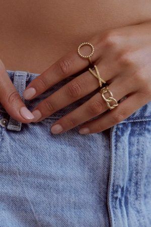 woman wearing the gold Theodora Ring by the sustainable brand Agapé Studio, curated by Morsel Store