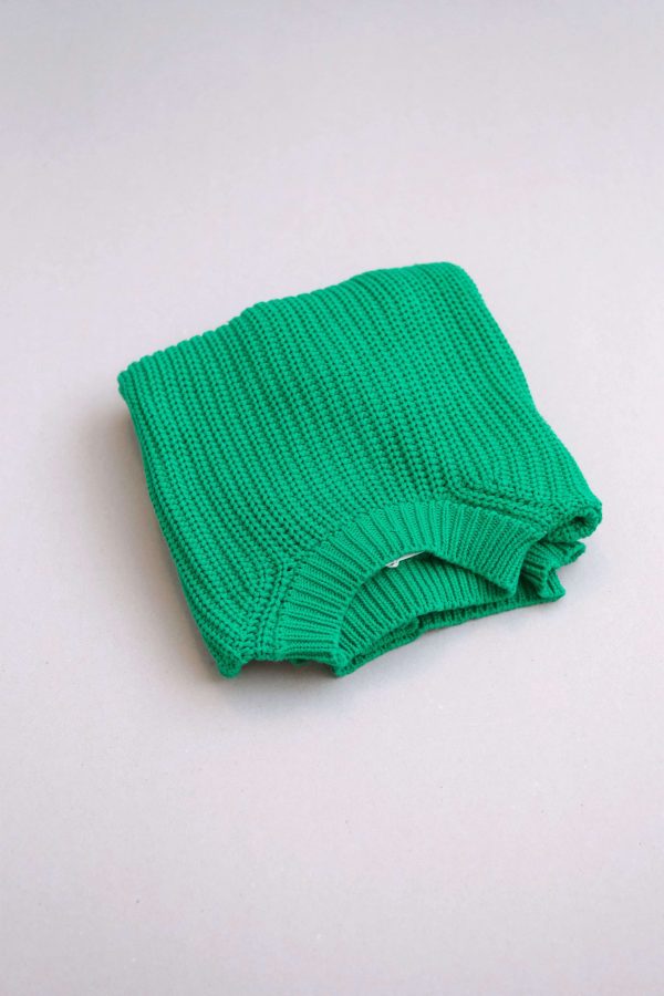 flatlay of the chunky pullover in emerald by the brand Summer and Storm