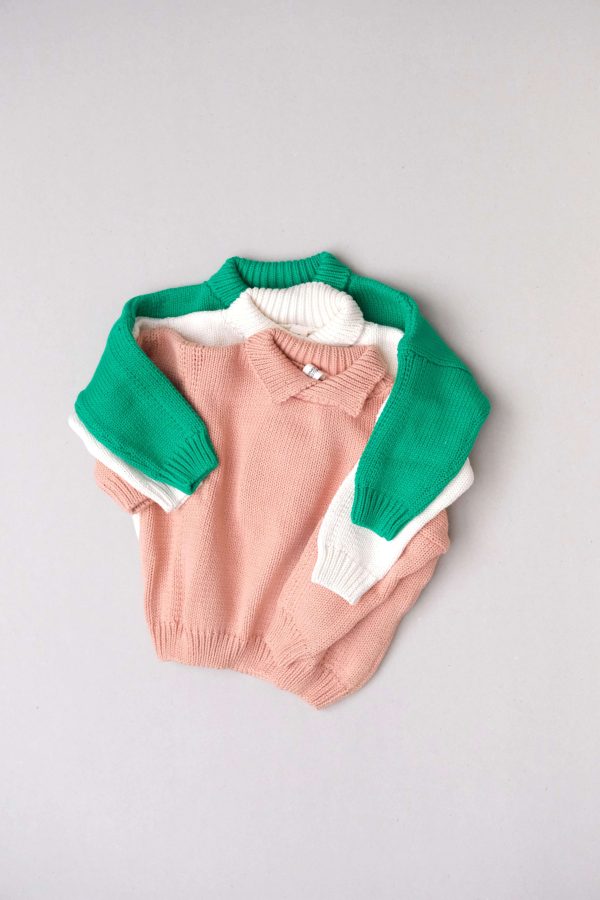 flatlay of the collared knit in coral, cream and emerald by the brand Summer and Storm