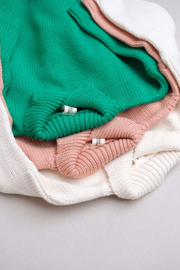flatlay of the collared knit in emerald, coral & cream by the brand Summer and Storm