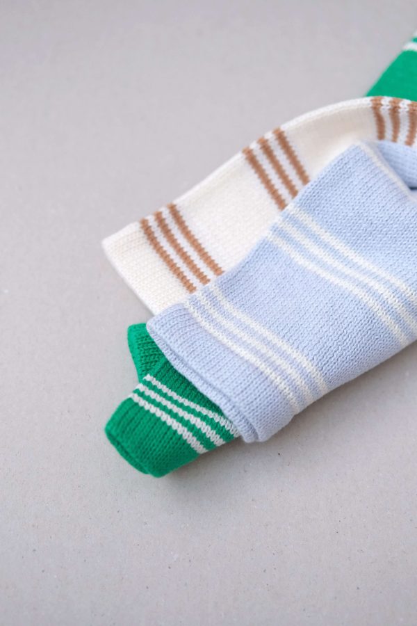 the Knitted Pullover in Powder Blue, caramel & emerald by the brand Summer and Storm