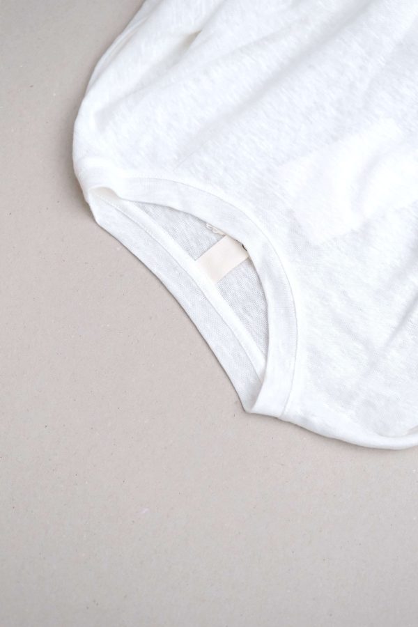 flatlay of the linen longsleeve tee in white by the brand Summer and Storm