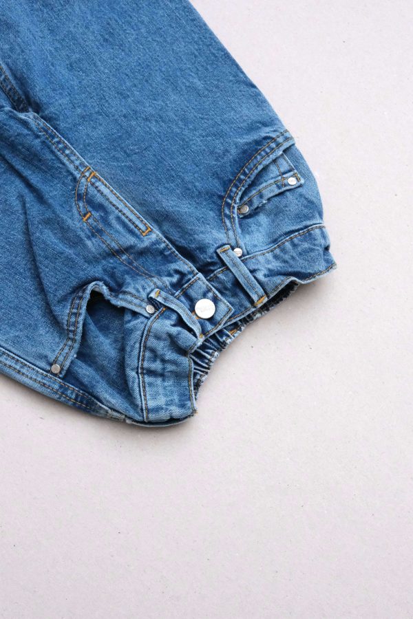 the 80s denim jean in midwash by the brand Summer and Storm