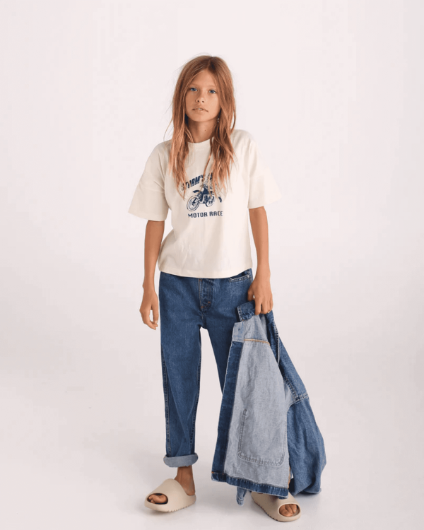 the 80s denim jean in midwash by the brand Summer and Storm