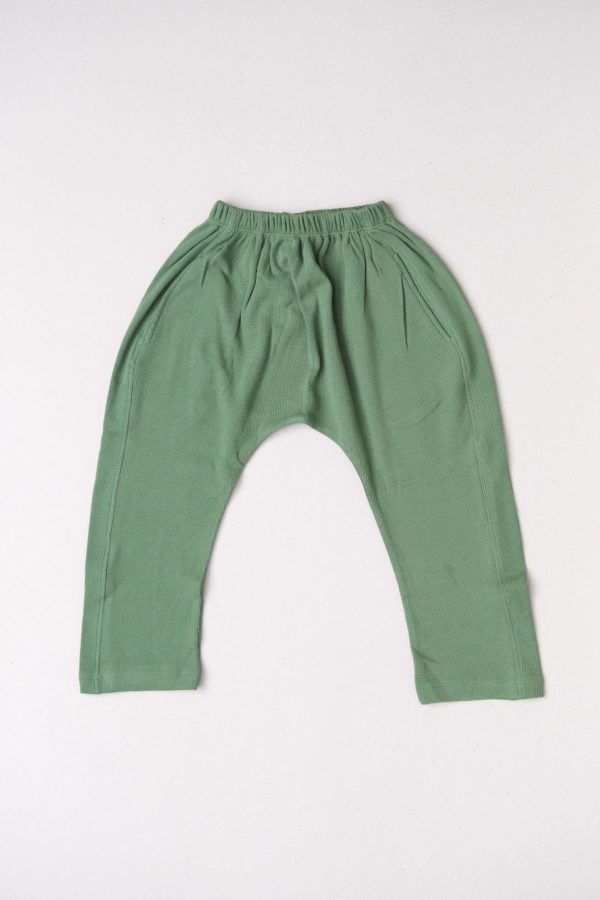 the waffle slouch pants in forest green by the brand Summer & Storm
