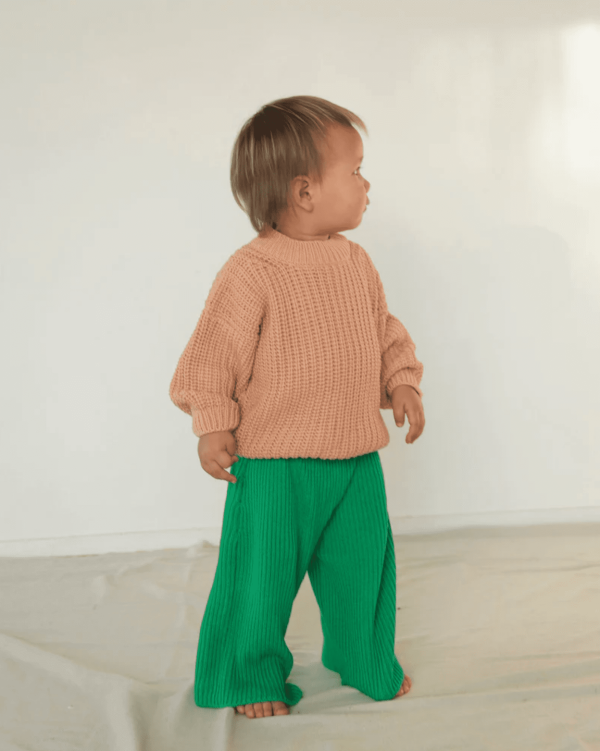 the wide knit pants in emerald paired with the chunky pullover by the brand Summer and Storm