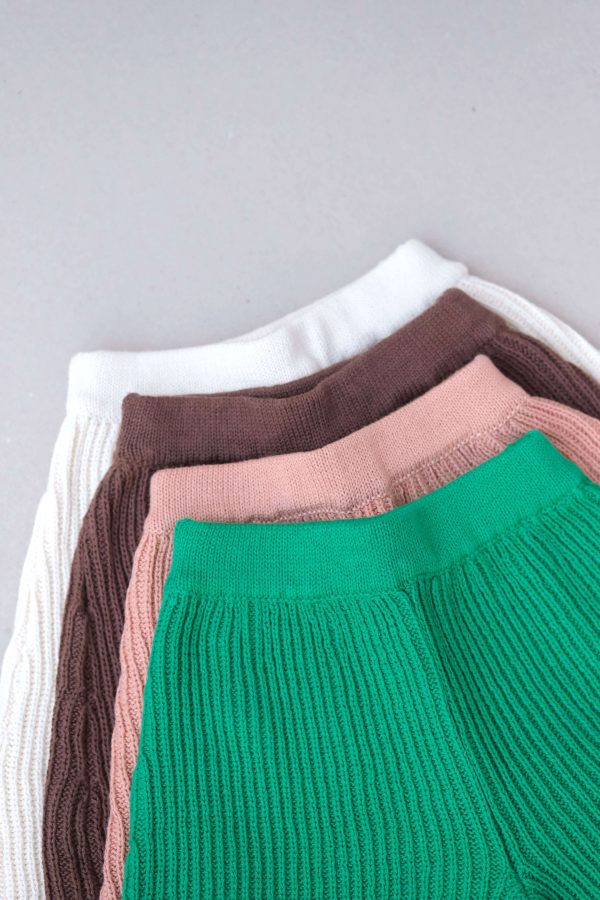 the wide knit pants in emerald, coral, coco & ivory by the brand Summer and Storm