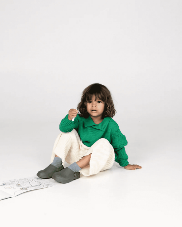 the wide knit pants in ivory paired with the collared knit in Emerald by the brand Summer and Storm