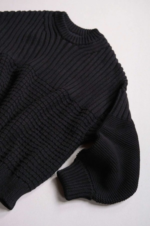 the Delcia Sweater in Black by the brand The Knotty Ones