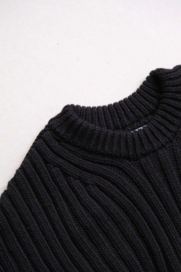 the Delcia Sweater in Black by the brand The Knotty Ones