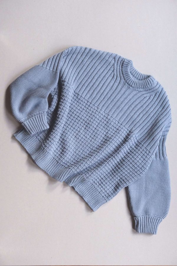 the Delcia Sweater in Blue by the brand The Knotty Ones