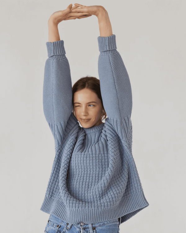 the Delcia Sweater in Blue by the brand The Knotty Ones