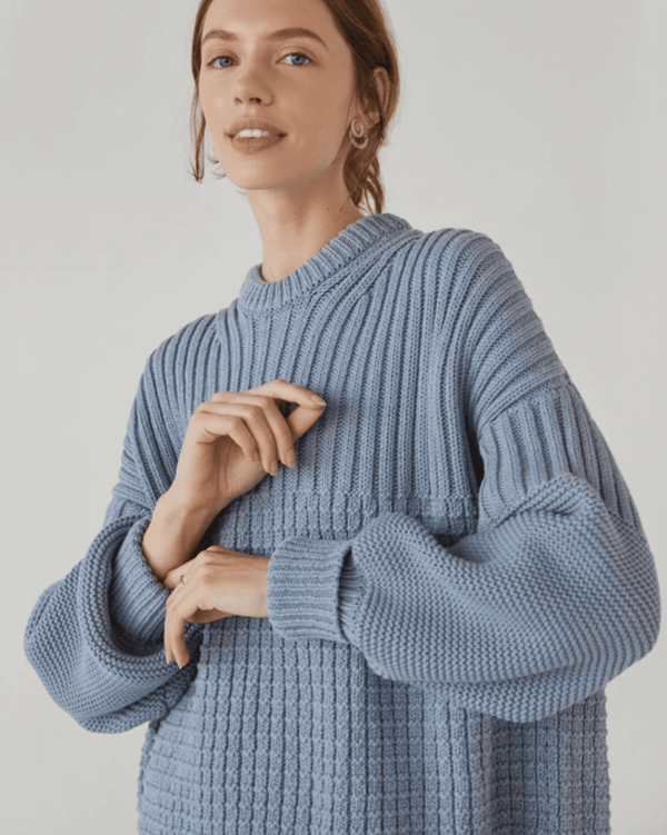 the Delcia Sweater in Blue by the brand The Knotty Ones