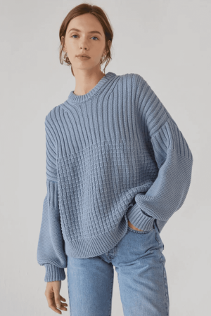 the Delcia Sweater in Blue by the brand The Knotty Ones