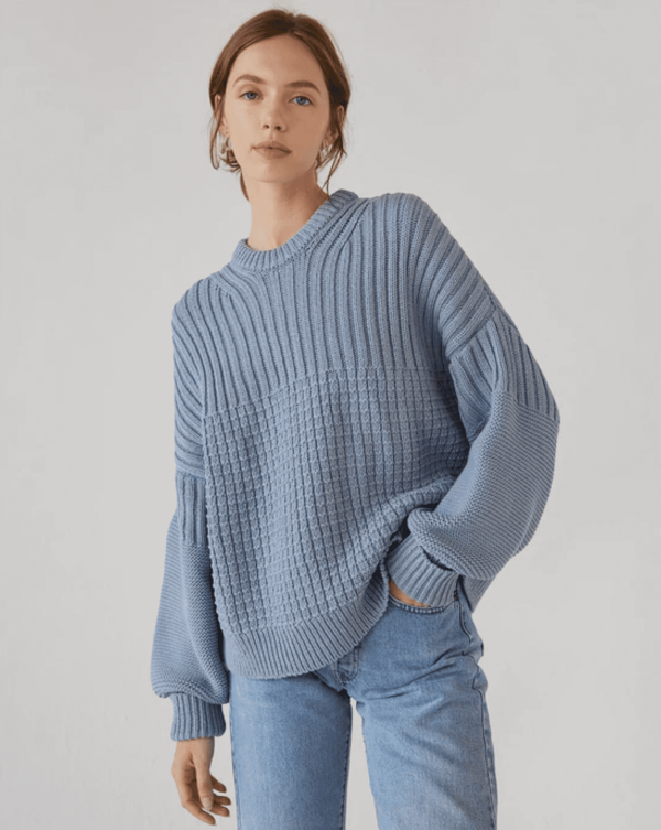 the Delcia Sweater in Blue by the brand The Knotty Ones