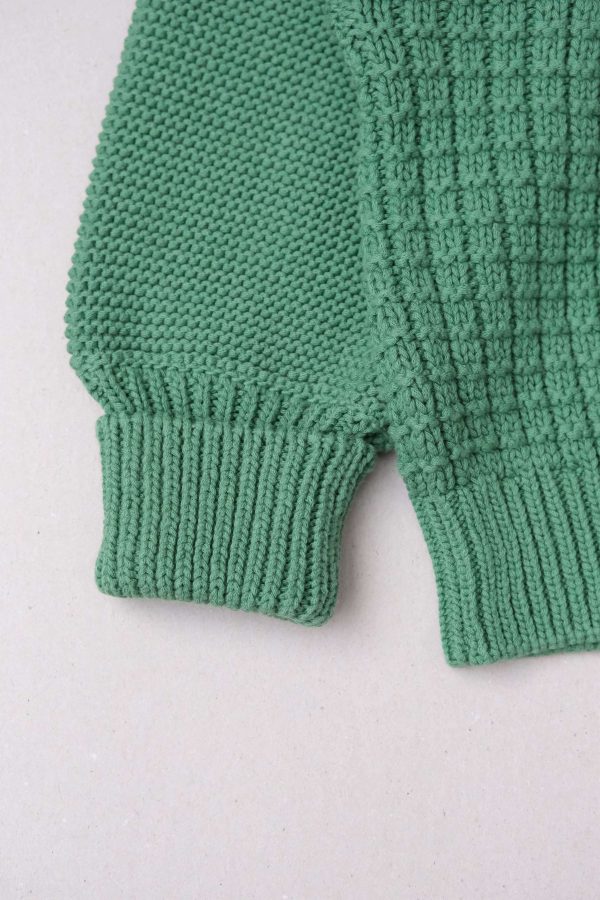 the Delcia Sweater in Fern Green by the brand The Knotty Ones