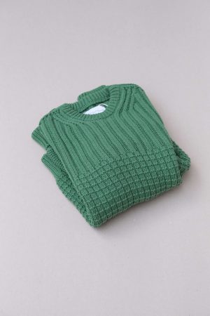 the Delcia Sweater in Fern Green by the brand The Knotty Ones