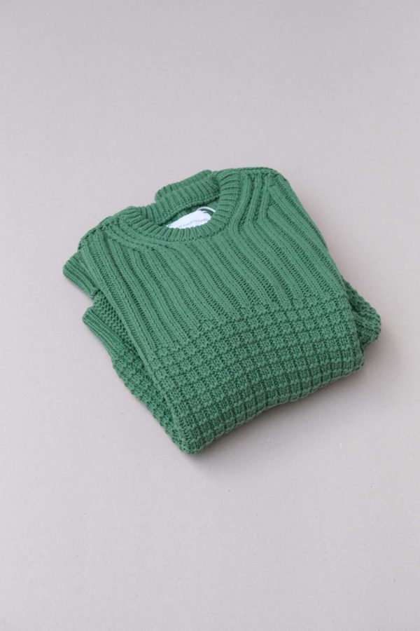the Delcia Sweater in Fern Green by the brand The Knotty Ones