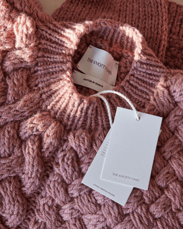 the Heartbreaker Sweater in dusty Pink by the brand The Knotty Ones