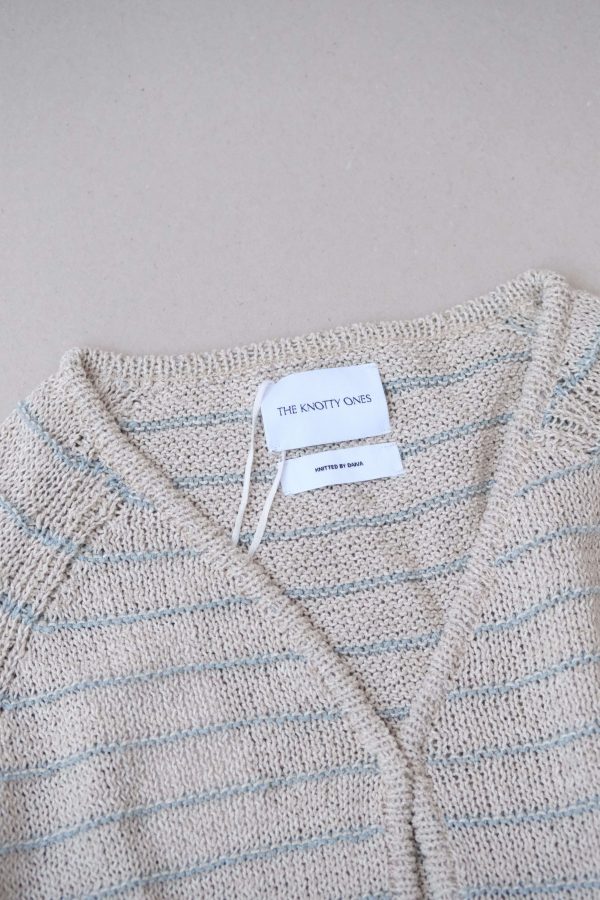 the Neringa Cardigan in Natural Linen by the brand The Knotty Ones
