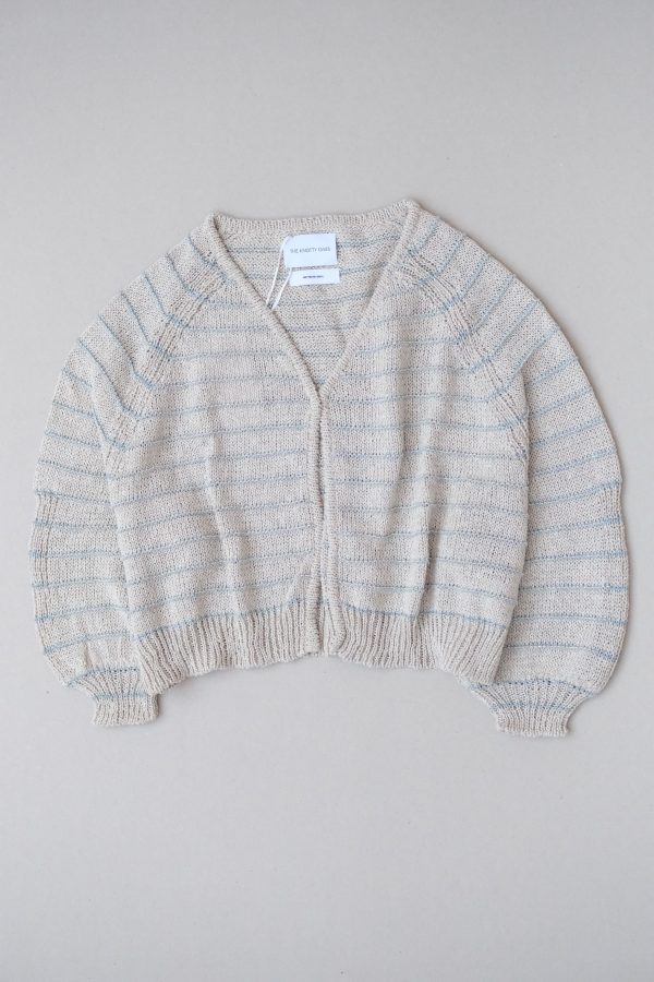 the Neringa Cardigan in Natural Linen by the brand The Knotty Ones