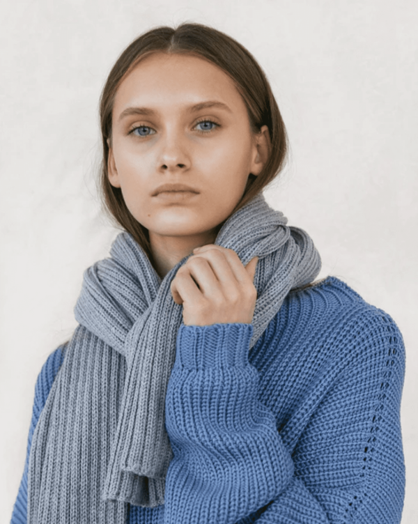 the knitted Rib Scarf in Grey by the brand The Knotty Ones