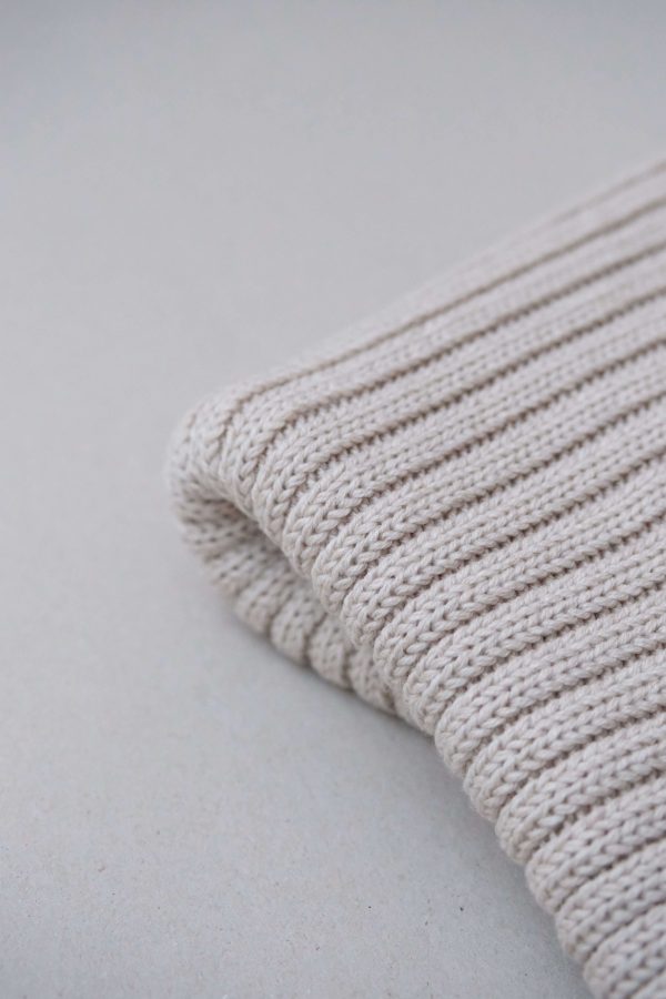 the knitted Rib Scarf in Pearl by the brand The Knotty Ones