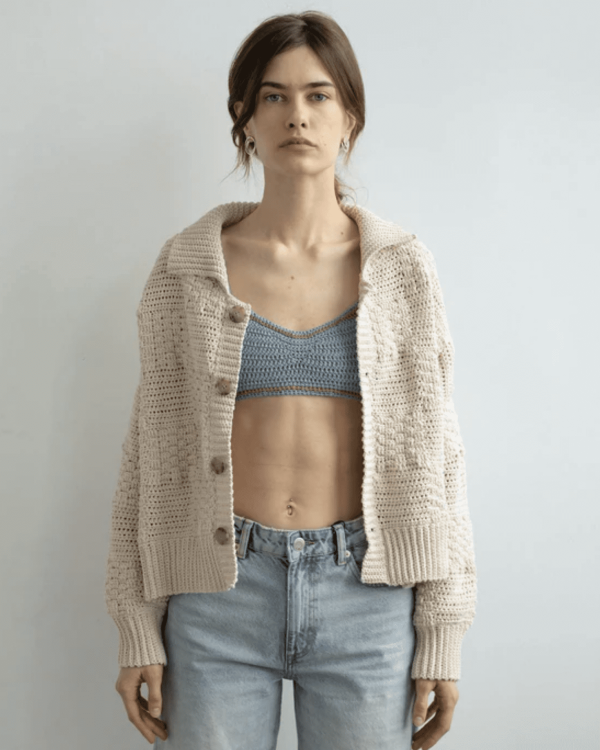 the knitted Zemelapis Bralette in Sea paired with the Prietema Cardigan by the brand The Knotty Ones