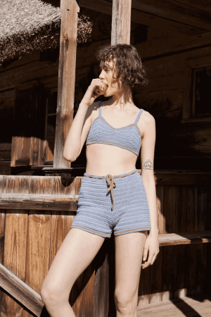 the knit Zemelapis Shorts in Sea paired with the Zemelapis Bralette by the brand The Knotty Ones
