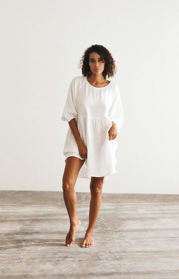 Woman wearing the Eden Dress in White by the brand The Bare Road